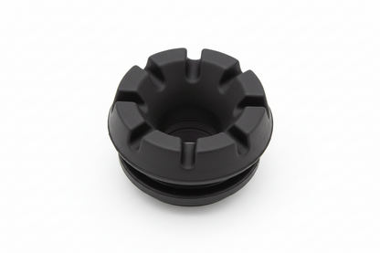 A black rubber cup holder insert featuring a durable, notched design that provides a secure and stable fit for beverages in various console applications.